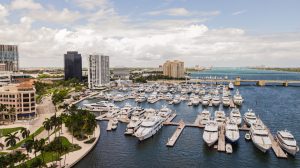 An aerial view of a marina with boats docked, offering charter flights in Florida.