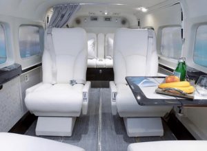 Experience luxury on a private jet with white leather seats. Charter a plane to the Bahamas for an unforgettable vacation.